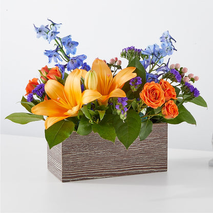Bouquet radieux de boîtes d'agrumes